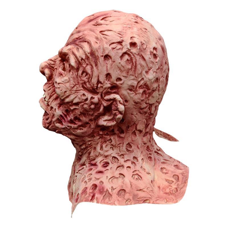 Close-up of scarred latex texture — Freddy mask surface detail, realistic horror finish