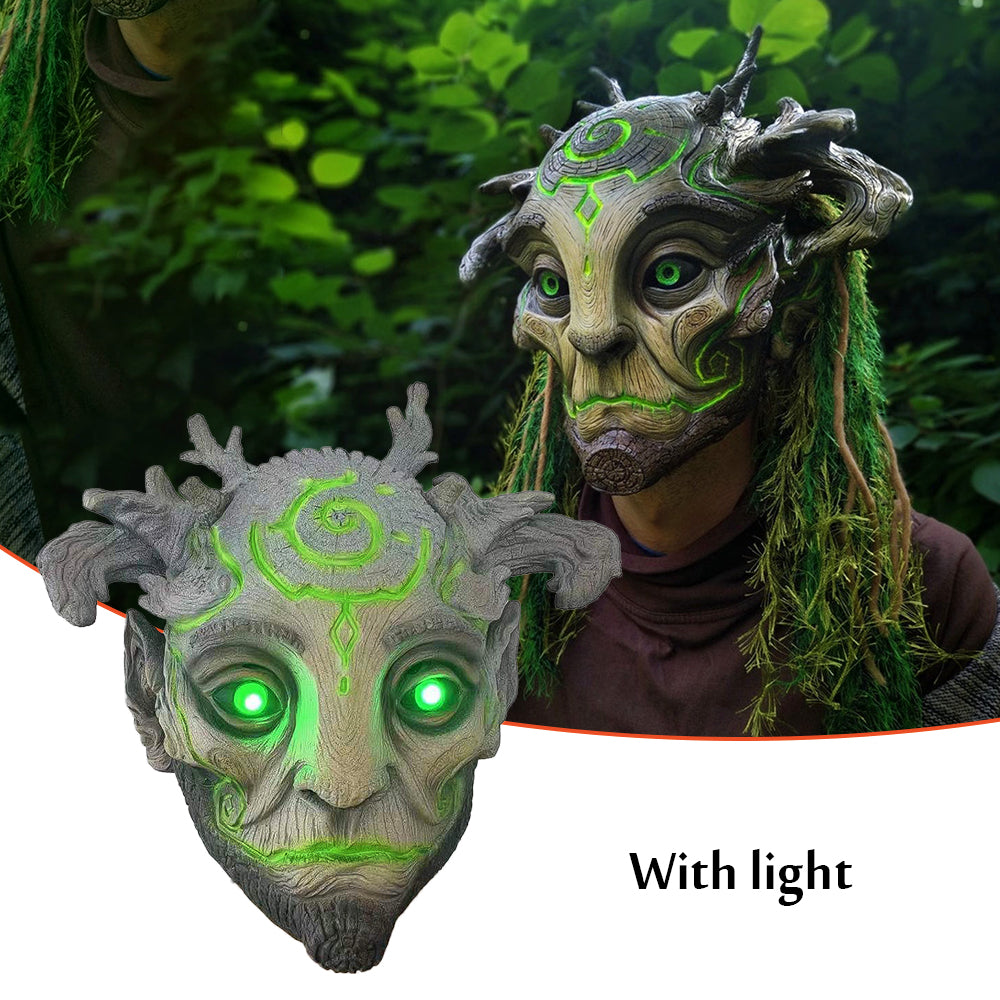 Fantasy mask with green glowing eyes and detailed design, set against a natural background.