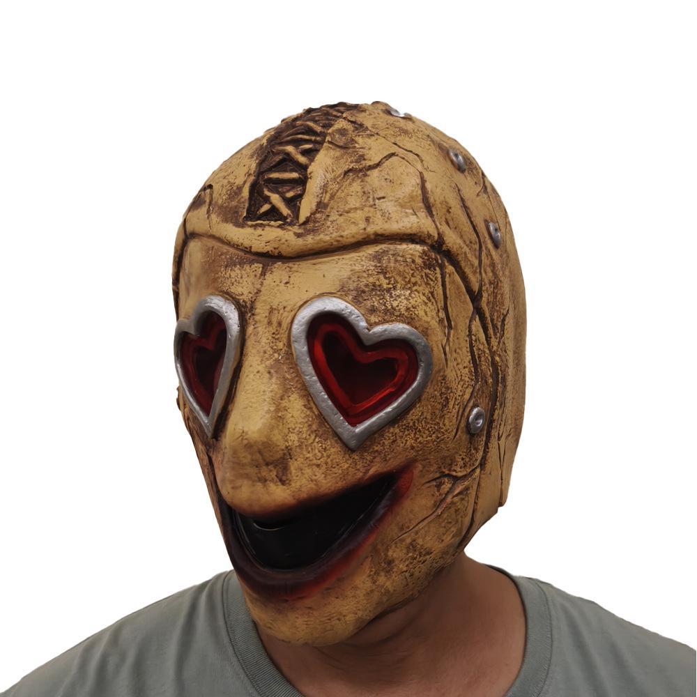 Heart Eye Mask worn on model — bolted face with deep red heart eyes, warm studio light